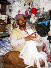 A Bijnauri labourer prepares nets at the only fishing net shop in Amritsar.