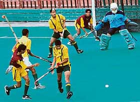 A semi-final hockey match in progress between Punjab and UP at the Sector 42 Stadium in Chandigarh on Tuesday.