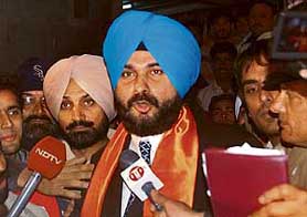 Navjot Singh Sidhu, a former cricketer and former MP, surrounded by his supporters at the railway station in Chandigarh on Tuesday evening. 