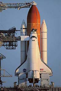 The space shuttle Discovery is poised for launch atop Pad 39B at the Kennedy Space Center in Cape Canaveral, Florida