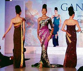 Models showcase dresses and jewellery, designed by Yumi Katsura, at a fashion show in Bangalore