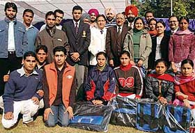 Sportspersons and officials pose on the PU campus in Chandigarh