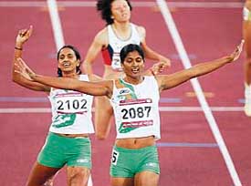 Indias JJ Shobha and compatriot Soma Biswas cross the finish line in the 800m race of the womens heptathlon event at the Khalifa Stadium in Doha on Saturday. Japans Yuki Nakata won the gold, followed by Soma