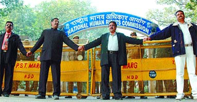 Some traders formed a 'human chain' to protest against ongoing sealing drive on World Human Rights Day