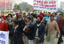 Members of the Kendri Punjabi Lekhak Sabha stage a protest march in Jalandhar on Sunday