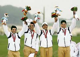 The Indian golf team waves after winning the silver medal in the golf team final