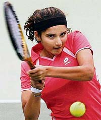 Sania Mirza returns to Thailands Suchanun Viratprasert during their womens singles quarterfinal match