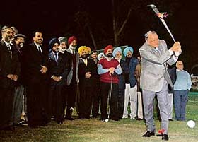 Punjab Governor S.F. Rodrigues takes the ceremonial tee-shot after switching on the floodlights at the Chandigarh Golf Club