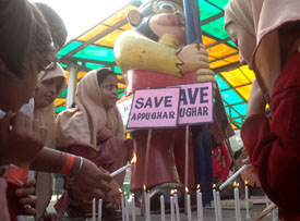 Schoolchildren light candles in Appu Ghar, an amusement park developed in the wake of Asiad Games held in the Capital in 1982, to express disappointment with its proposed closure