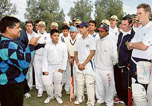 Former Test cricketer Ashok Malhotra (extreme left) interacts with budding cricketers from India and South Africa at Government Senior Secondary School, Sector 19, Chandigarh, on Wednesday. 