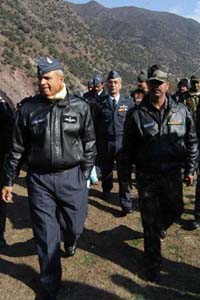 Air Marshall A.K. Singh of HQ Western Air Command (L) visits Uroosa village of last year earthquake victims near the Line of Control in Baramulla district