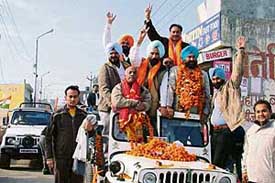 Mayor Nahar Singh Gill holds a roadshow in Ludhiana on Wednesday.