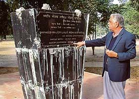 Mr Brij Bedi points towards the missing bust of Capt Lalit Mohan Bhatia, who died fighting in the 1971 Indo-Pak war, from the historic Rambagh in Amritsar