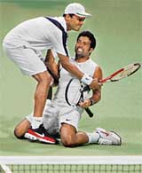 Leander Paes and Mahesh Bhupati celebrates a crucial point in the gold medal mens doubles final of the Asian Games on Wednesday