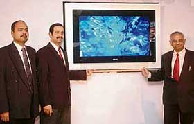 (From left): Mr Gunjan Srivastva, Director, Entertainment, Philips, Mr Shailesh Prabhu, Head Marketing, CTV, and Dr R.B. Jain, President, All-India Ophthalmological Society, launch Ambilight full-surround TV in New Delhi on Thursday. The Philips 32-inch' Ambilight TV comes at a price of Rs 1,14,990 while 42-inch Ambilight costs Rs 2,49,990.