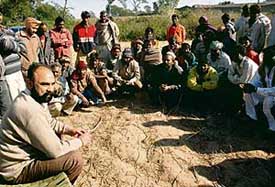 Congress leader Jagjit Singh Kang, alias Gora Kang, speaks to members of uprooted families at Gholumajra village in the vicinity of Ammunition Depot in Dappar, on Thursday. 