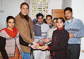 Students of Government Rajindra College present a memento to the MLA of British Columbia, Mr Jagrup Brar, in Bathinda on Thursday. 