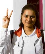 Koneru Humpy shows victory sign after she defeated her Kazakh opponent Dana Aketayeva in the final round
