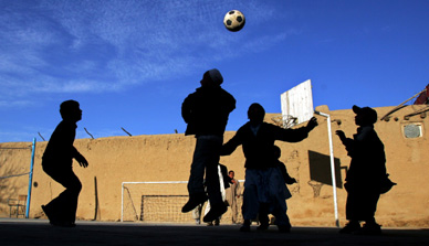 As the year comes to a close, Taliban are believed to be advancing on Kabul, the capital of Afghanistan. The picture shows children, orphaned during the countrys bloody past, playing football in the northern city of Mazar-e-Shariff. The picture is rated among the best pictures of 2006.