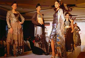 Models display designer wear during a fashion show in Chandigarh
