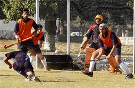 A hockey match in progress between the Agra and Noida teams during the 44th North Zone Inter-Varsity Hockey Tournament in Ludhiana on Friday.