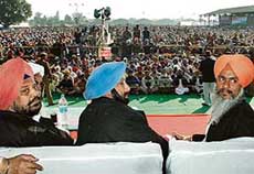 Chief Minister Amarinder Singh with Punjab Subordinate Services Board member Harmohinder Singh Gill and Excise and Taxation Minister Sardul Singh Bundala at a rally