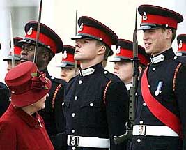  Britain's Queen Elizabeth smiles at her grandson Prince William (right) as she inspects graduates during a passing out parade at the Royal Military Academy Sandhurst, near CAmberley, England on Friday. The graduates, including Prince William, marched in Friday's sovereign's parade.