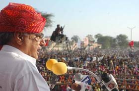 Chief Minister Bhupinder Singh Hooda addresses a rally in Balsamand village