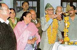 A lamp being lighted to mark the martyrdom of Swami Shradanand in Ludhiana on Sunday.