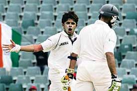 The flip side: S. Sreesanth taunts South Africas Hashim Amla after dismissing him on the third day of the first Test in Johannesburg on Sunday.