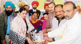 Dr Indu, SDM, Ludhiana (West), receives a memento at a function organised by the Help Line Youth Club, Mandi Ahmedgarh, on Sunday.