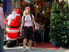 YULETIDE SPIRIT: Shoppers throng Khan Market in Central Delhi where shopkeepers have decked up the entire place with Christmas trees and other symboligises.