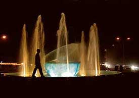 A boy watches jets of water spewing out of the fountain near the YPS roundabout at Mohali on Wednesday