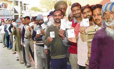 Voters queue up to cast their ballot in the MC poll at a polling booth in Mauli Jagran, Chandigarh, on Wednesday