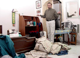 A neighbour shows the ransacked house in Sector 4 of Mansa Devi Complex in Panchkula on Wednesday