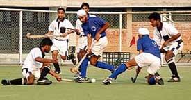 A match in progress between Guru Nanak Dev University, Amritsar, and Gurukul University, Hardwar, during the 44th North Zone Inter-Varsity Hockey Tournament on the PAU campus, Ludhiana, on Wednesday