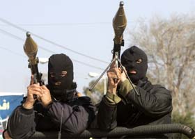 Palestinian militants from the Fatah movement attend the funeral of Mahmoud Dogmosh and his relative Asraf Dogmosh in Gaza