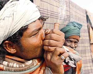 Samir Kumar from Orissa smokes ganja in a bid to forget life’s tensions in Ludhiana.
