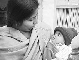 A five-month-old baby girl, who was recovered from a train on Wednesday night, being looked after by the family of a Sahara worker in Bathinda. 