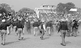A view of the police using force to disperse protesting veterinary pharmacists at Shaheedi Jor Mela at Chamkaur Sahib.