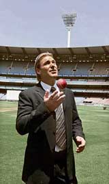 Australias Shane Warne tosses the ball after announcing his retirement from international and domestic cricket at a press conference in Melbourne on Thursday