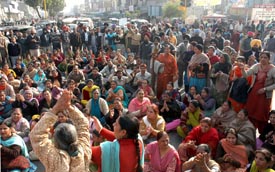 Members of the Punjab State Aided School Teachers and Other Employees Union hold a protest against the state government in Ludhiana on Friday