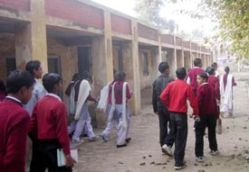 Students come out of the unsafe building at Government Senior Secondary School, Dehlon, near Ahmedgarh