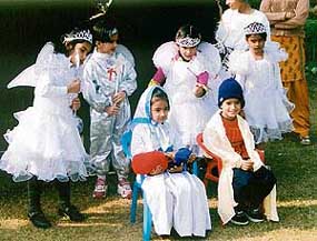 Students of Jesus Sacred Heart School celebrate Christmas in the school on Saturday.