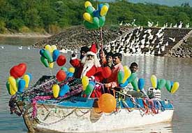 Santa Claus warms the hearts of visitors at Sukhna Lake on Christmas eve in Chandigarh on Sunday