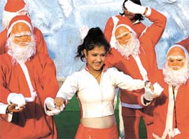 Santa Claus dancing with a girl during a Christmas party at Appu Ghar on Sunday evening.