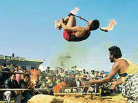 Bazigars display thier skills with fire at the Virasat Mela in Bathinda on Sunday.