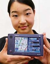 A Sanyo employee displays a handy navigation system "Gorilla NV-SD10DT", equipped with 1GB flash memory to store the map datas and a digital broadcasting tuner on its tiny body, measuring 141 x 83 x 25mm and weighing only 290 g, in Tokyo on Monday. 