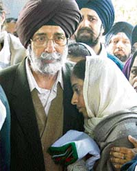 Col G.S.Sarna's father consoles his daughter-in-law when the Army officer's body was brought to Brar Square at Delhi Cantonment in New Delhi