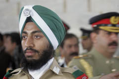 First Sikh cadet Harcharn Singh from the Pakistan Military Academy (PMA) stands guard at Jinnah's mausoleum in Karachi on Monday. A contingent of PMA cadets mounted the guard at the mausoleum of Mohammad Ali Jinnah to mark his 130th birth anniversary.   Reuters